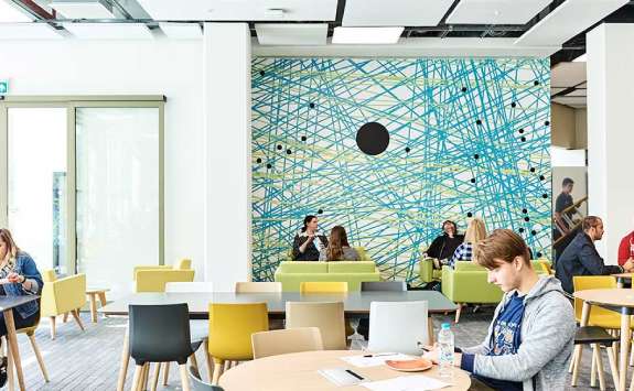 Students sitting in the Urban Sciences Building Cafe